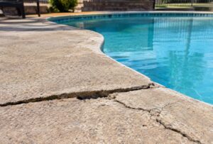 Signs a Louisiana pool deck needs replacement versus resurfacing