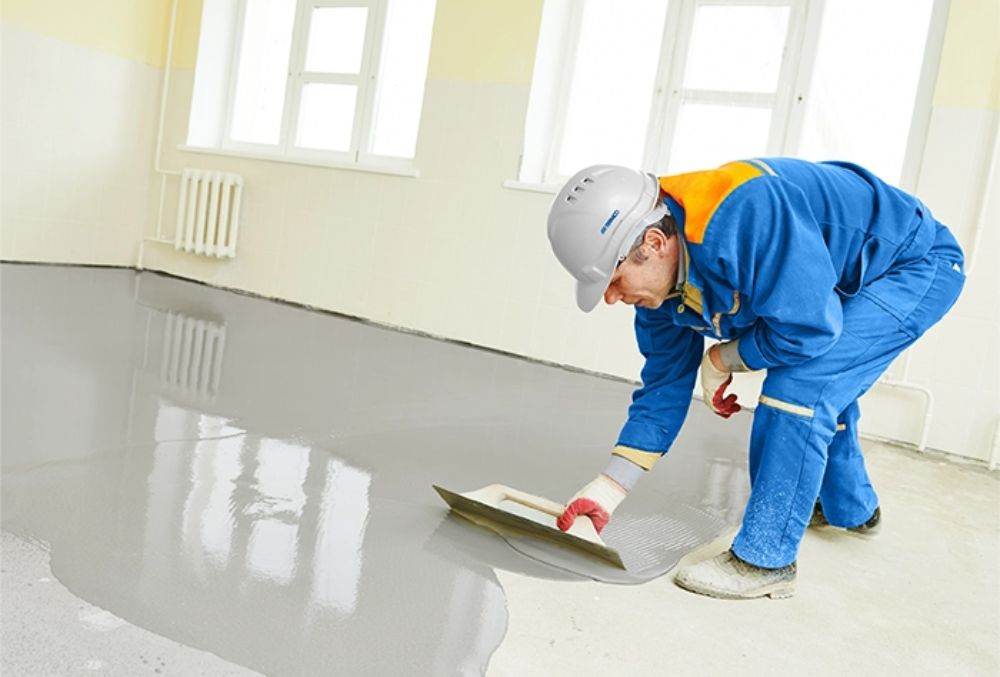 contractor applying epoxy coating