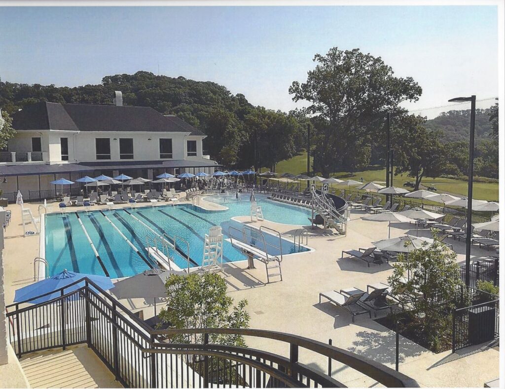 Outdoor recreation area with a concrete pool deck.