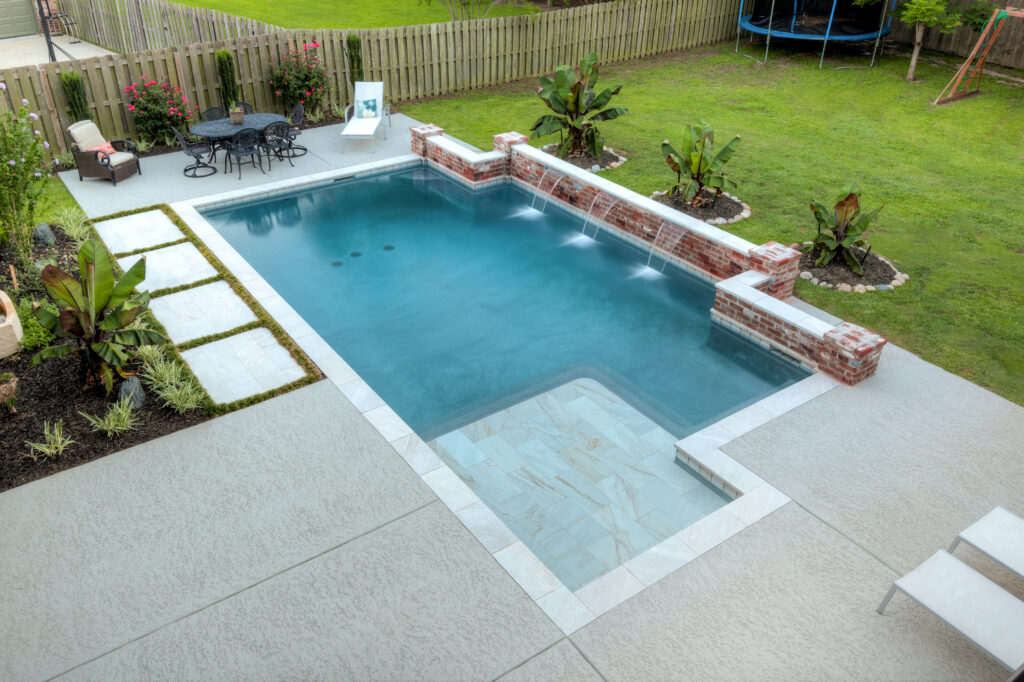Worn concrete pool deck compared to a resurfaced Classic Texture pool deck finish